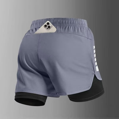 Pantalones cortos deportivos de doble capa con bolsillo para el teléfono y forro.