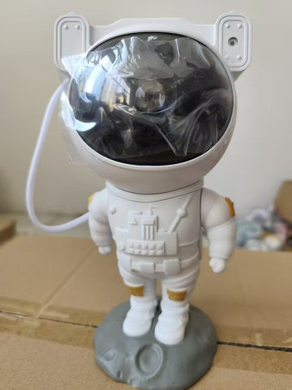 Lámpara de noche con proyección de estrellas de astronauta y control remoto.
