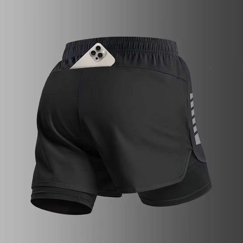 Pantalones cortos deportivos de doble capa con bolsillo para el teléfono y forro.